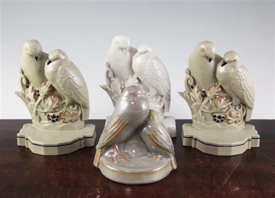 A pair of Poole Pottery Lovebirds bookends and another similar bookend, largest 7.75in.